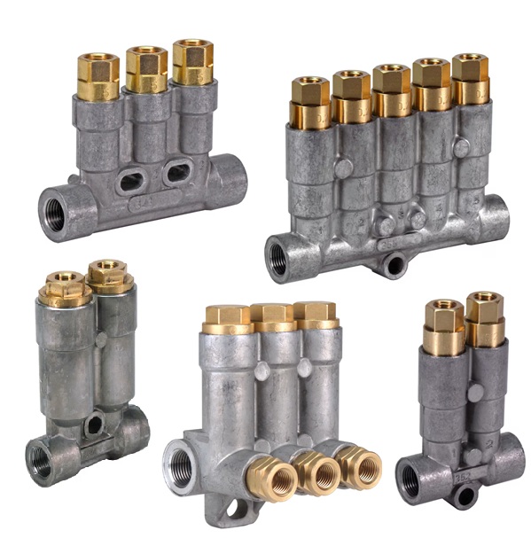 Industrial piston distributor and divider valve assemblies